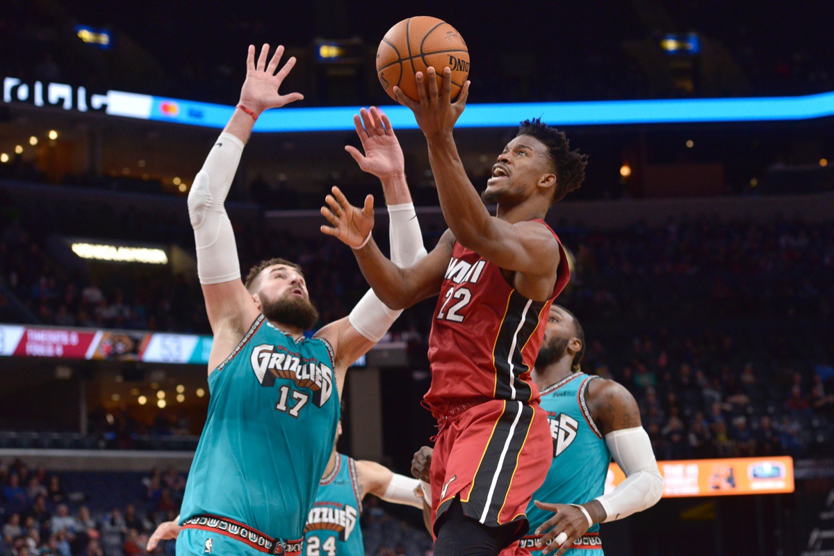 <strong>Miami Heat forward Jimmy Butler (22) shoots against Memphis Grizzlies center Jonas Valanciunas (17) Dec. 16 at FedExForum.</strong> (Brandon Dill/AP)