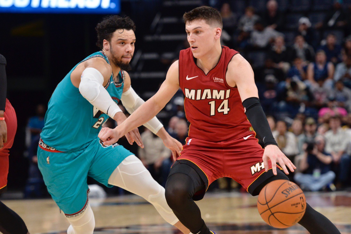 <strong>Miami Heat guard Tyler Herro (14) handles the ball against Grizzlies guard Dillon Brooks Dec. 16 at FedExForum.</strong> (Brandon Dill/AP)