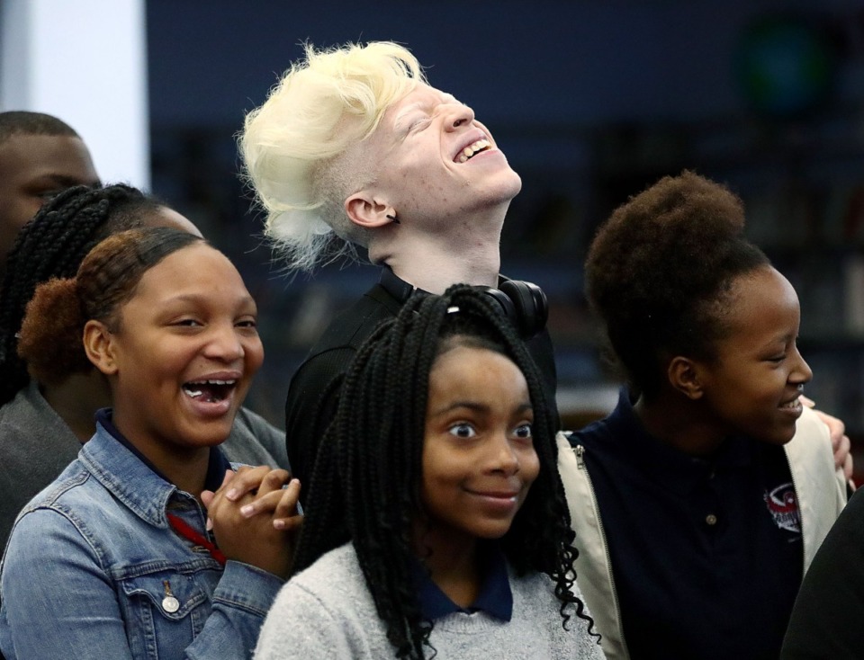<strong>Local rapper Roben X shares a laugh with a group of Wooddale Middle School students on Dec. 16 while visiting the school to spread an anti-bullying message.</strong> (Patrick Lantrip/Daily Memphian)
