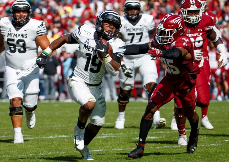 <strong>Memphis running back Kenneth Gainwell (19) runs for a touchdown as Temple safety Amir Tyler (25) reaches for him during an NCAA college football game on Oct. 12, in Philadelphia.</strong> (AP Photo/Chris Szagola)