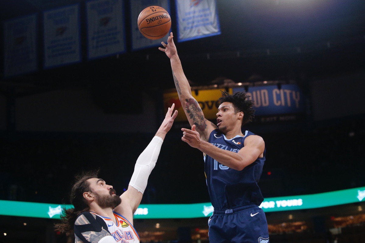 <strong>Grizzlies forward Brandon Clarke (15) shoots over Oklahoma City Thunder center Steven Adams, left, Dec. 18 in Oklahoma City.</strong> (Sue Ogrocki/AP