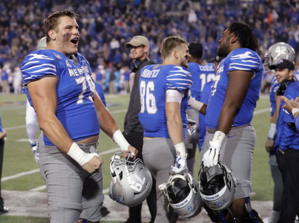 <strong>Memphis offensive lineman Scottie Dill (79) celebrates in the final minutes of the team's NCAA college football game against SMU Nov. 2 at the Liberty Bowl. Memphis won 54-48.</strong> (Mark Humphrey/AP)