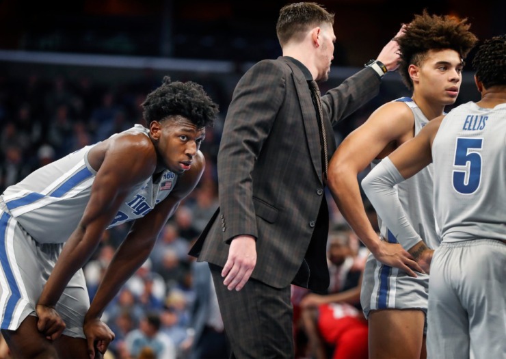 <strong>Memphis center James Wiseman (left) catches his breath during a time out against UIC on Nov. 8, 2019 at FedExForum.</strong> (Mark Weber/Daily Memphian)