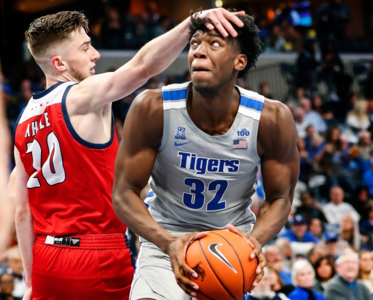 <strong>Memphis center James Wiseman (right) is knocked in the head by UIC defender Jamie Ahale (left) during action on Nov. 8, 2019, at FedExForum.</strong> (Mark Weber/Daily Memphian)