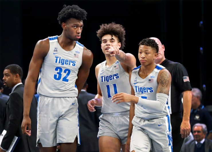 <strong>Memphis center James Wiseman (left) talks with teammates Lester Quinones (middle) and Boogie Ellis (right) during a break in action against UIC om Nov. 8, 2019, at FedExForum.</strong> (Mark Weber/Daily Memphian)