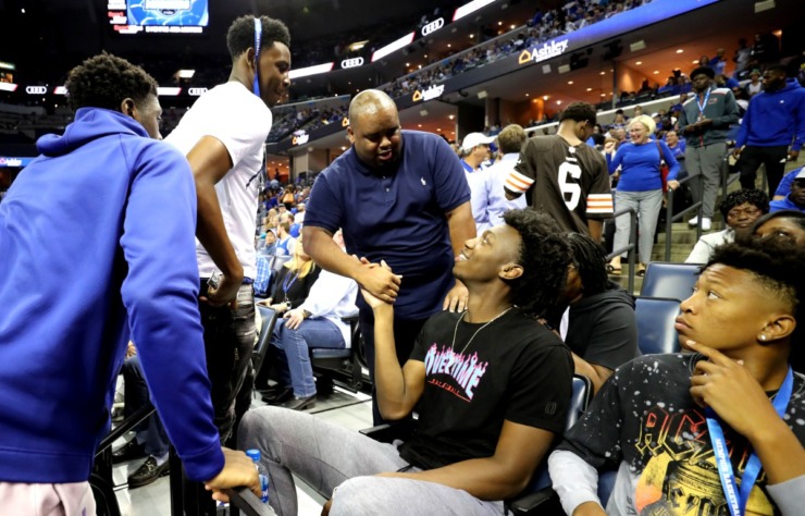 <strong>James Wiseman (center), a recruit for the Memphis Tigers basketball team, shakes hands with fans at 2018 Memphis Madness at FedExForum&nbsp;</strong>(Houston Cofield/The Daily Memphian)