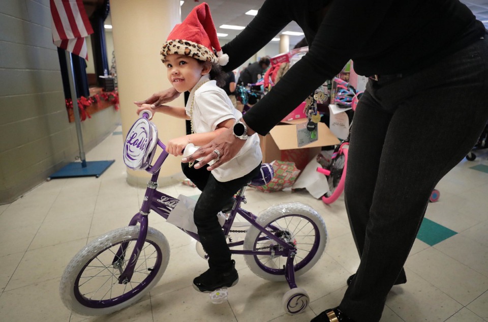 <strong>Vollentine kindergartner Dalis Morrison tries out his new bike on Thursday, Dec. 19. The Sheriff&rsquo;s Office partnered with the Boll Weevil Charity Foundation and Target at Wolfchase to donate gifts for the students.&nbsp;&ldquo;To see the smiles on their faces is just pure Christmas joy,&rdquo; said Boll Weevil president&nbsp;Todd Brown.</strong>&nbsp;(Jim Weber/Daily Memphian)