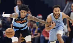 <strong>Cavalier Kevin Porter Jr. (4) and Grizzly Kyle Anderson (1) battle for the ball Dec. 20 in Cleveland.</strong> (Tony Dejak/AP)