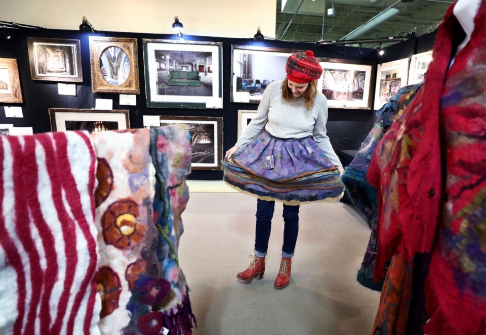 <strong>Selena Nause tries on a festive skirt from Mary Ambrose's all-felt Siss Viss designs at the WinterArts collection in East Memphis on Dec. 19, 2019.</strong> (Patrick Lantrip/Daily Memphian)