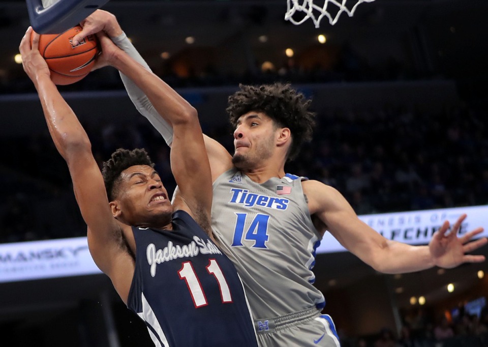 <strong>University of Memphis forward Isaiah Maurice (14) blocks a shot by Jackson State's Jayveous McKinnis (11) during the first half of the Tigers' game on Dec. 21, 2019, against JSU at the FedExForum.</strong> (Jim Weber/Daily Memphian)