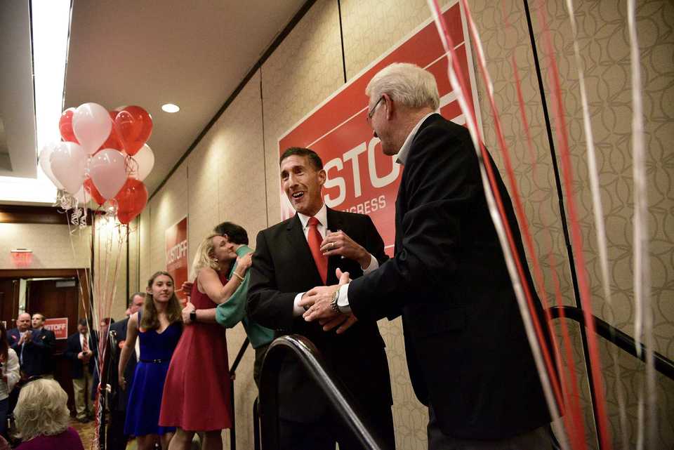 <strong>David Kustoff is greeted by Mark Luttrell during a campaign watch party to celebrate his retaining the 8th Congressional district seat.</strong> (Stan Carroll/Special To The Daily Memphian)