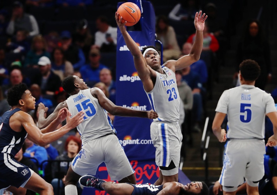 <strong>University of Memphis forward Malcolm Dandridge (23) pulls down a rebound against Jackson State during the Tigers' game on Dec. 21, 2019, against JSU at the FedExForum.</strong> (Jim Weber/Daily Memphian)
