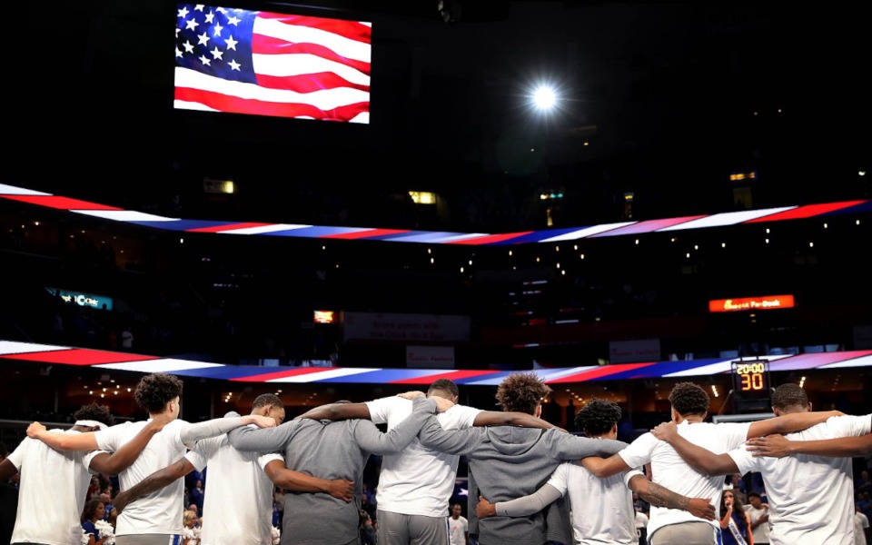 <strong>The University of Memphis basketball team gathers for the national anthem before the start of the Tigers' game on Dec. 21, 2019, against JSU at the FedExForum.</strong> (Jim Weber/Daily Memphian)