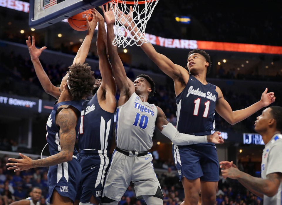 <strong>University of Memphis guard Damion Baugh (10) goes up against a host of Jackson State defenders for a rebound during the Tigers' game on Dec. 21, 2019, against JSU at the FedExForum.</strong> (Jim Weber/Daily Memphian)