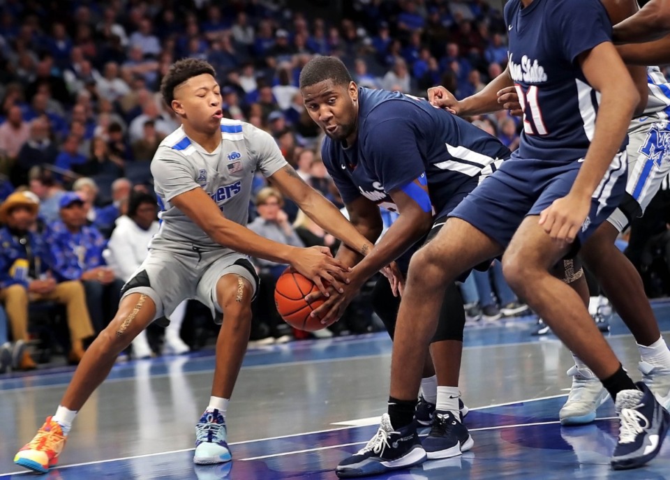 <strong>University of Memphis guard Boogie Ellis (left) steals the ball from Jackson State's Khalil Spencer (30) during the Tigers' game on Dec. 21, 2019, against JSU at the FedExForum.</strong> (Jim Weber/Daily Memphian)