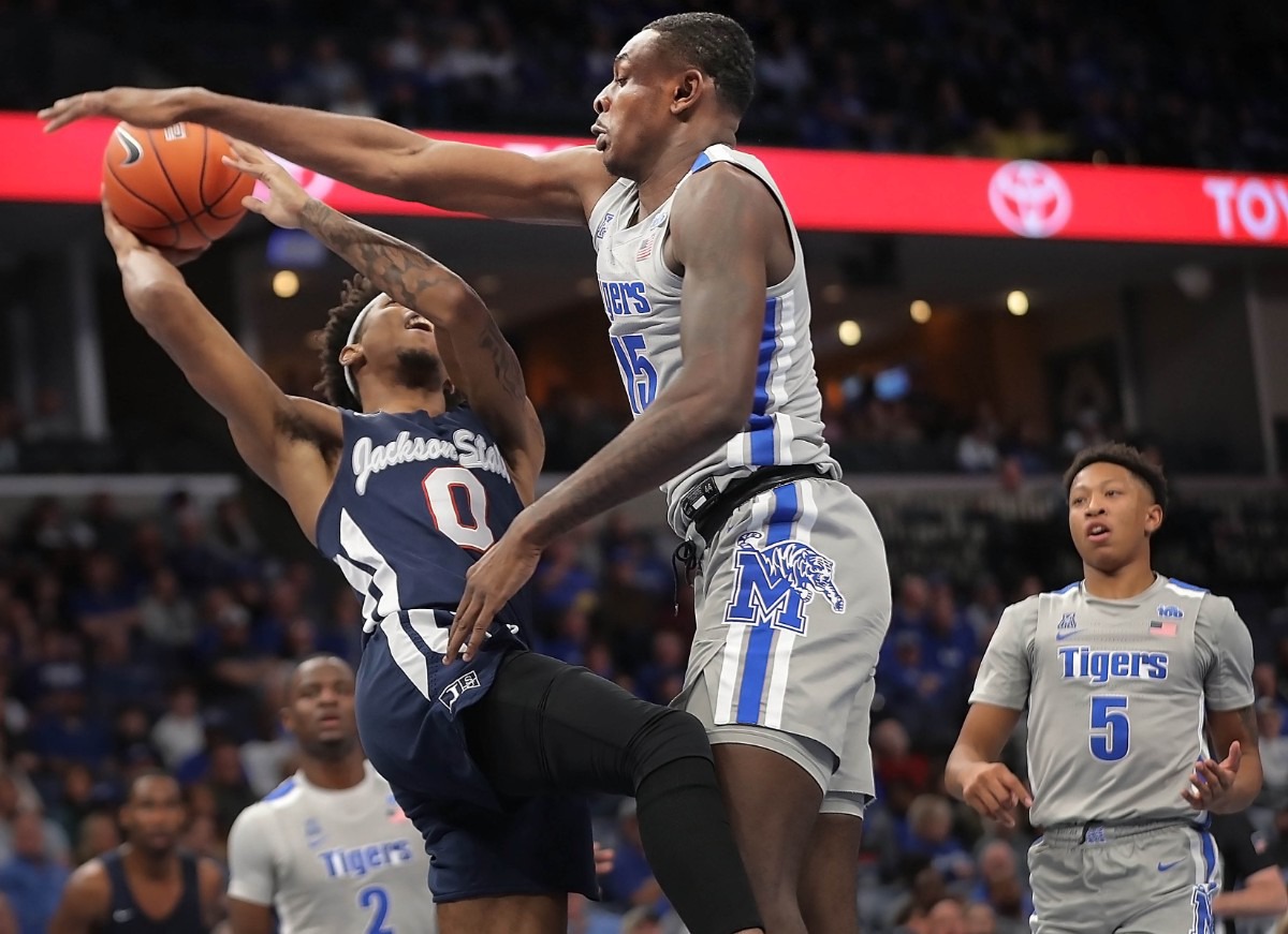 <strong>University of Memphis forward Lance Thomas (15) fouls Jackson State's Venji Wallis (0) during the Tigers' game on Dec. 21, 2019, against JSU at the FedExForum.</strong> (Jim Weber/Daily Memphian)