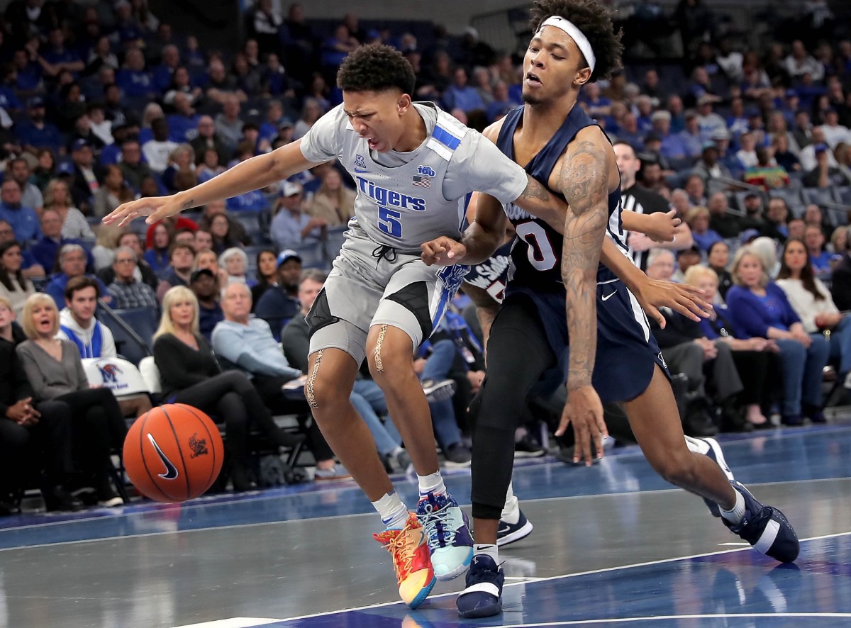 <strong>University of Memphis guard Boogie Ellis (5) is fouled by Jackson State's Venji Wallis (0) during the Tigers' game on Dec. 21, 2019, against JSU at the FedExForum.</strong> (Jim Weber/Daily Memphian)