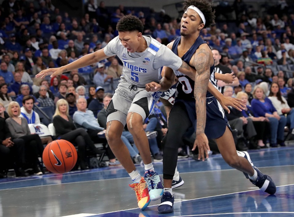 <strong>University of Memphis guard Boogie Ellis (5) is fouled by Jackson State's Venji Wallis (0) during the Tigers' game on Dec. 21, 2019, against JSU at the FedExForum.</strong> (Jim Weber/Daily Memphian)
