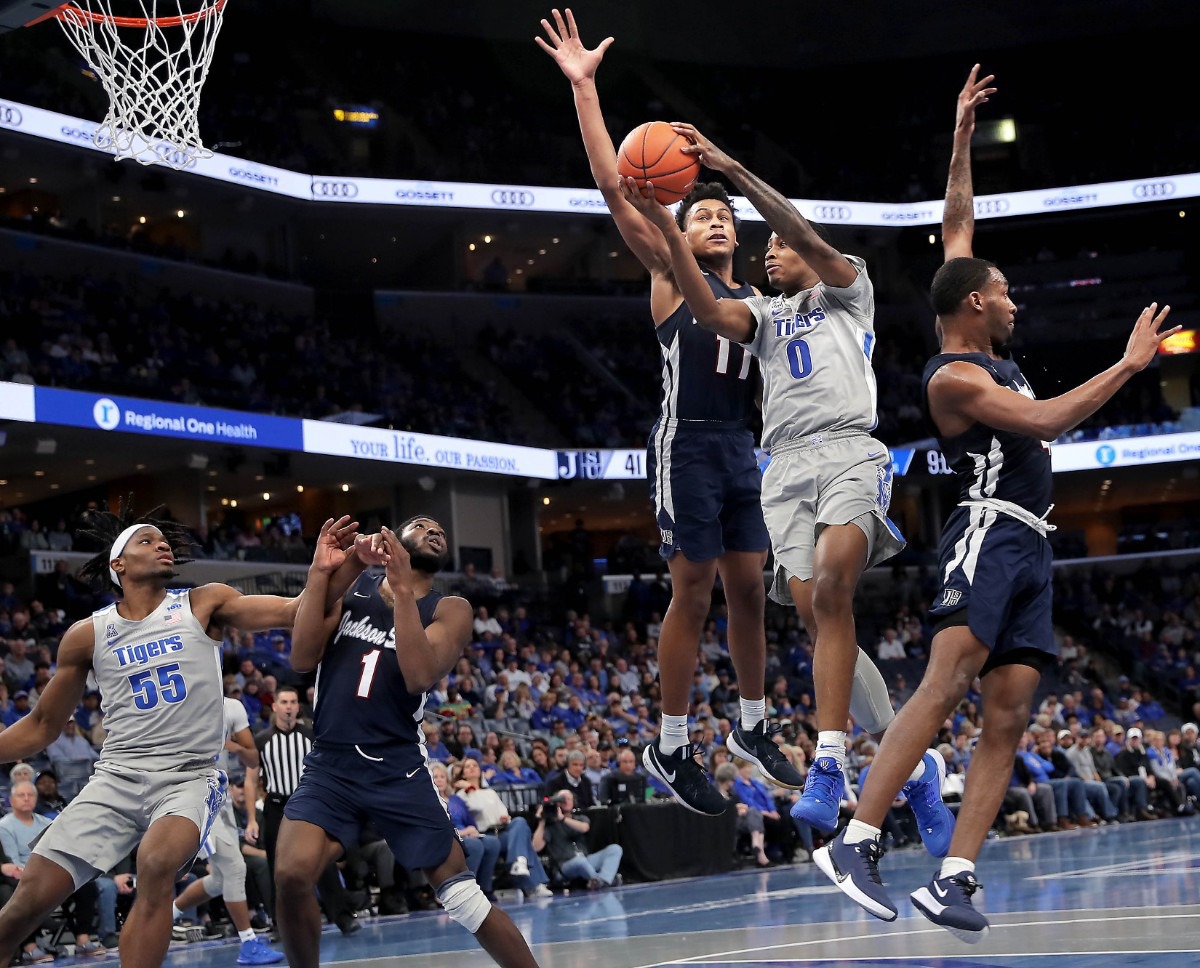 <strong>University of Memphis forward DJ Jeffries (0) shoots under pressure by Jackson State's Jayveous McKinnis (11) during the Tigers' game on Dec. 21, 2019, against JSU at the FedExForum.</strong> (Jim Weber/Daily Memphian)