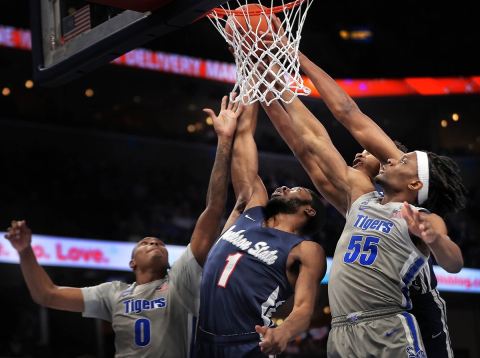 <strong>University of Memphis forward Precious Achiuwa (55) tries to pull down a rebound under pressure by Jackson State's Roland Griffin (1) during the Tigers' game on Dec. 21, 2019, against JSU at the FedExForum.</strong> (Jim Weber/Daily Memphian)