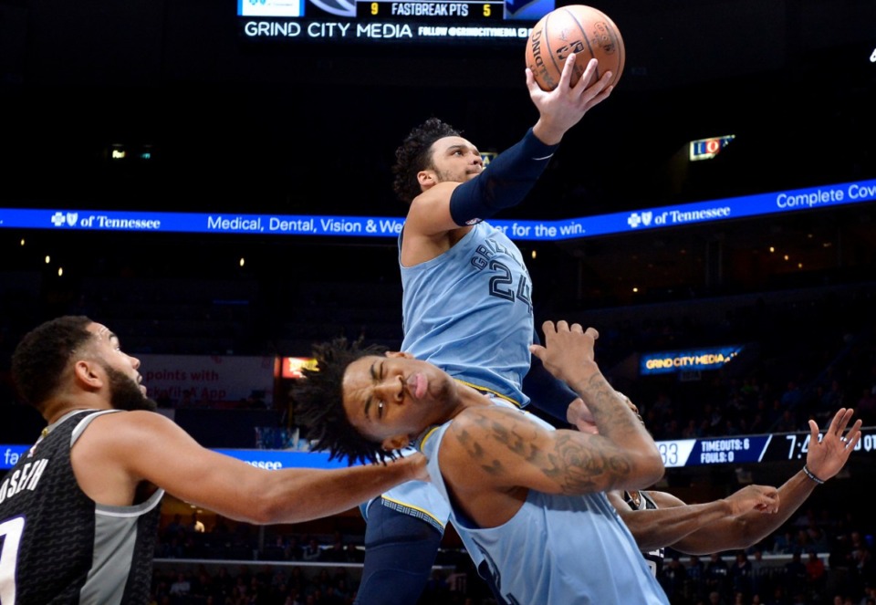 <strong>Memphis Grizzlies guard Dillon Brooks (24) shoots above guard Ja Morant and Sacramento Kings guard Cory Joseph (9) in the first half of an NBA basketball game on Dec. 21, 2019, in Memphis.</strong> (AP Photo/Brandon Dill)