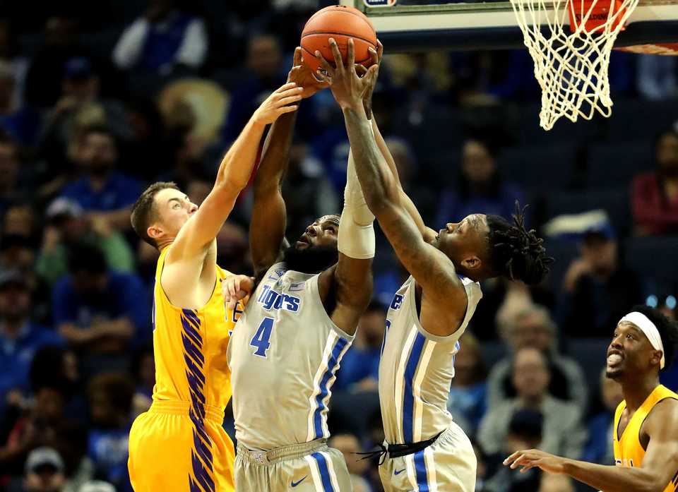 <strong>University of Memphis forward Raynere Thornton (4) wrestles for a rebound against Tennessee Tech in the season opener on Tuesday, Nov. 6, at FedExForum. The Tigers won, 76-61.&nbsp;</strong>(Houston Cofield/Daily Memphian)