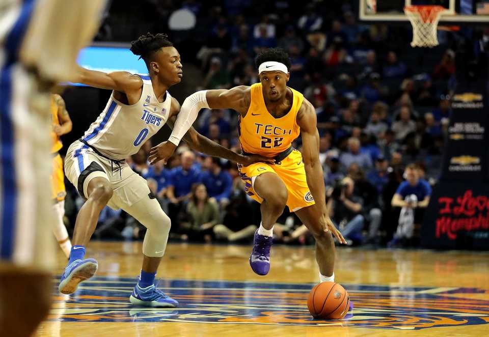 <strong>University of Memphis forward Kyvon Davenport (0) puts pressure on Tennessee Tech forward Courtney Alexander II (22) as he drives to the basket in the Tigers' season opener against the Golden Eagles at FedExForum on Tuesday, Nov. 6. </strong>(Houston Cofield/Daily Memphian)