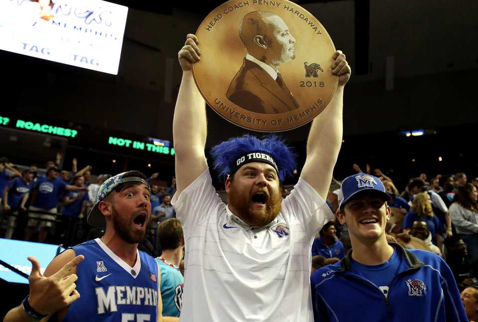 <strong>Ryne Ladley (from left), Brandon Bumgarner and Mark Spain cheer for the University of Memphis before the Tigers' season opener on Tuesday, Nov. 6, against Tennessee Tech.&nbsp;</strong>(Houston Cofield/Daily Memphian)