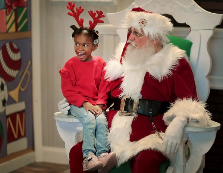 <strong>Adalyn Keaton, 4, gets in some one-on-one time with Santa, played by Charles Bohannon, during a trip to the Enchanted Forest at the Pink Palace on Dec. 24, 2019. The Enchanted Forest has been a holiday attraction in Memphis for more than 50 years, beginning its life in Goldsmith's Department Store with some of the same animatronic characters which still reside in the exhibit.</strong> (Jim Weber/Daily Memphian)