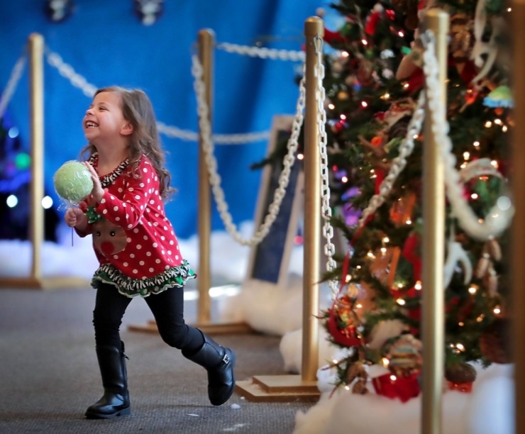 <p style="text-align: right;"><strong>Saylar Bradley, 3, gets a closer look at the Festival of Trees during a visit to the Enchanted Forest at the Pink Palace on Dec. 24, 2019.&nbsp;The Enchanted Forest has been a holiday attraction in Memphis for more than 50 years, beginning its life in Goldsmith's Department Store with some of the same animatronic characters which still reside in the exhibit.&nbsp;</strong>(Jim Weber/Daily Memphian)