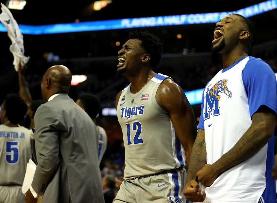 <strong>Memphis Tigers forward Victor Enoh (12) and forward Mike Parks Jr. (10) celebrate as the Tigers score a three pointer against Tennessee Tech in the season opener at FedExForum on Tuesday, Nov. 6. </strong>(Houston Cofield/Daily Memphian)