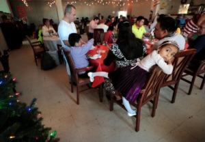 <strong>Odri Xocop, 4, waits between courses during the Caritas Community Center's first Christmas lunch on Dec. 25, 2019. The cafe hosted a three-course Christmas meal for 65 community members who would not otherwise be able to enjoy a holiday meal themselves.</strong> (Jim Weber/Daily Memphian)