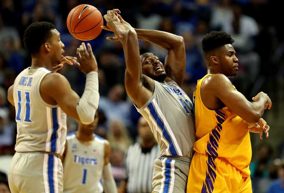 <strong>University of Memphis forward Victor Enoh (12) reaches for the ball in the season opener against Tennessee Tech at FedExForum on Tuesday, Nov. 6. The Tigers won, 76-61. </strong>(Houston Cofield/Daily Memphian)