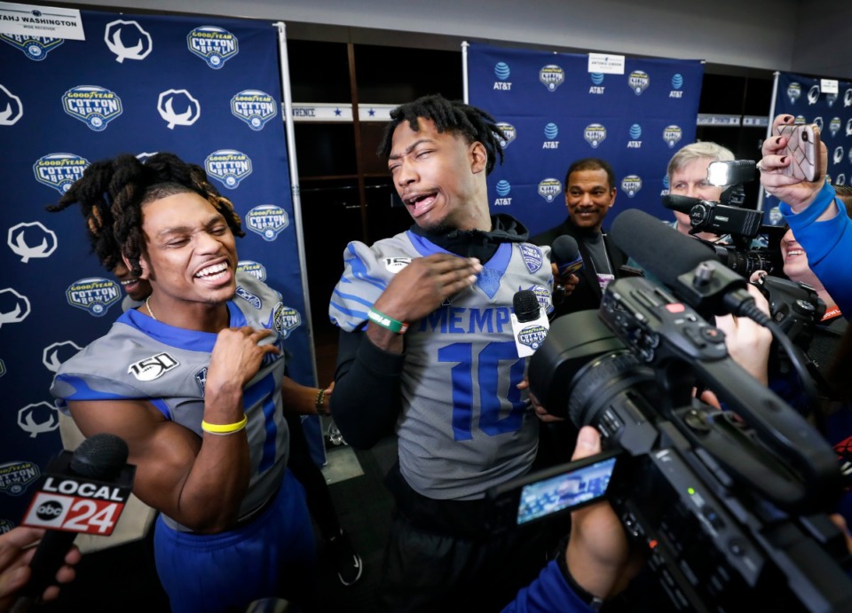 <strong>University of Memphis teammates Chris Claybrooks (right) and Damonte Coxie (left) joke for the cameras during the Cotton Bowl Media Day on Dec. 26, 2019, at AT&amp;T Stadium in Arlington, Texas. (</strong>Mark Weber/Daily Memphian)