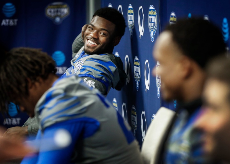 <strong>University of Memphis linebacker Thomas Pickens (left) jokes with his teammates during a breakout session at the Cotton Bowl Media Day on Dec. 26, 2019, at AT&amp;T Stadium in Arlington, Texas.</strong> (Mark Weber/Daily Memphian)