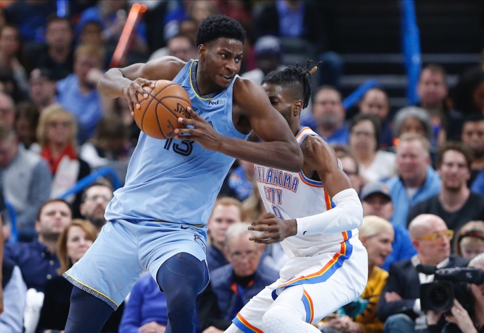 <strong>Memphis Grizzlies forward Jaren Jackson Jr. (13) drives to the basket past Oklahoma City Thunder center Nerlens Noel (9) Dec. 26 in Oklahoma City.</strong> (Alonzo Adams/AP)