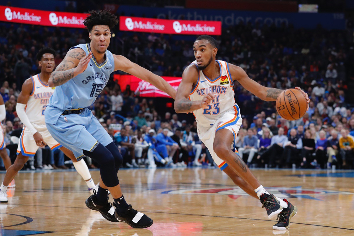 <strong>Oklahoma City Thunder guard Terrance Ferguson (23) battles Grizzlies forward Brandon Clarke (15) to the basket Dec. 26 in Oklahoma City.</strong> (Alonzo Adams/AP)