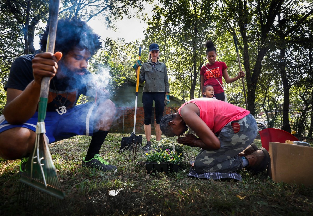 <strong>Local artist Tobacco Brown prays while blessing a vacant lot in the 1500 block of McMillan Street on Oct. 5, 2019. South Memphis residents, along with the Center for Transforming Communities and United Housing Inc. will hold Future Fest, a festival that celebrates affordable housing, home ownership and Afrofuturism, in the vacant lot where Brown will install an art piece.</strong> (Mark Weber/Daily Memphian)