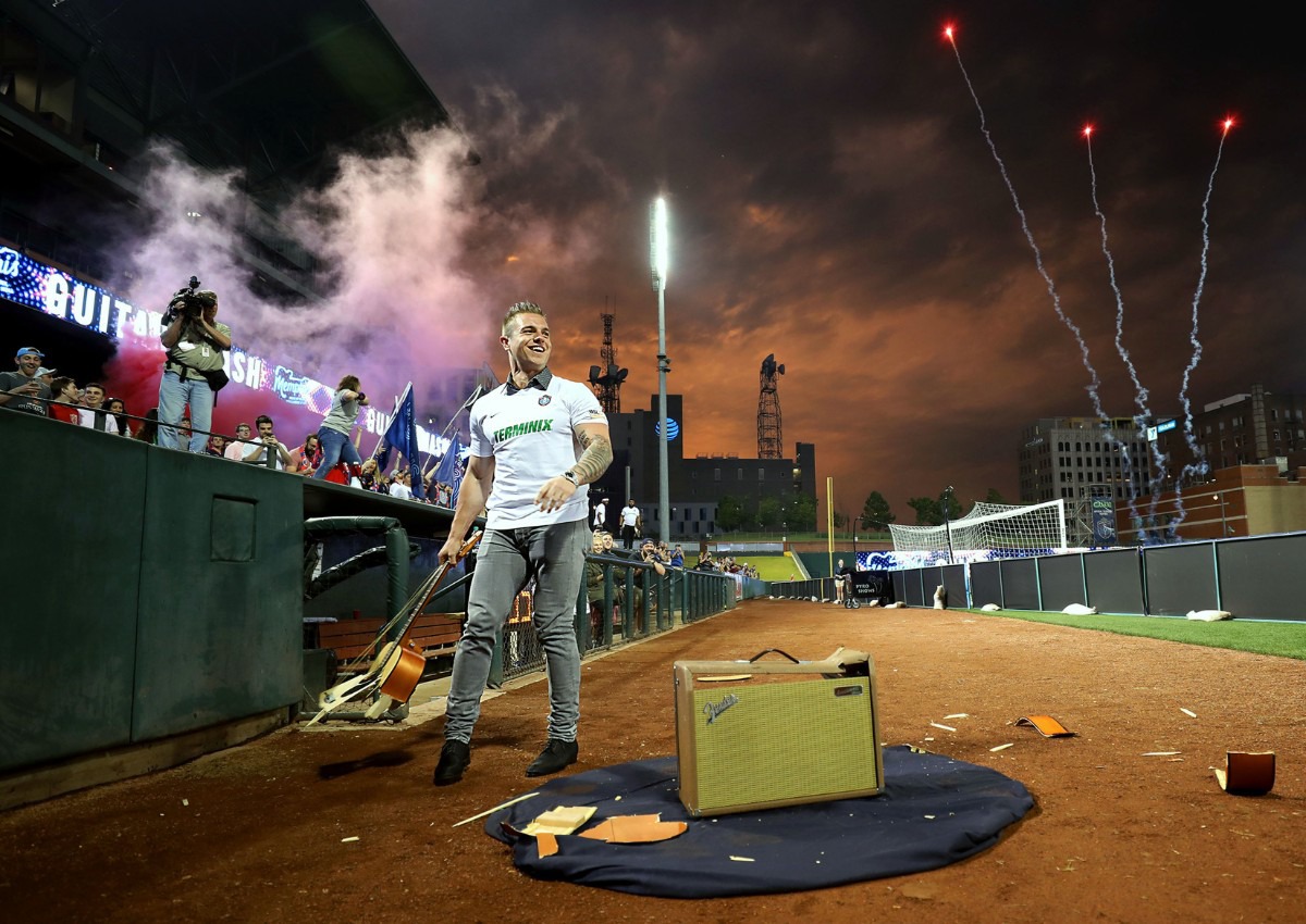 <strong>Memphis Redbirds outfielder Tyler O'Neill struts for the crowd after smashing a guitar before Memphis 901FC's home game against the New York Red Bulls U23 team on May 15, 2019.</strong> (Patrick Lantrip/Daily Memphian)