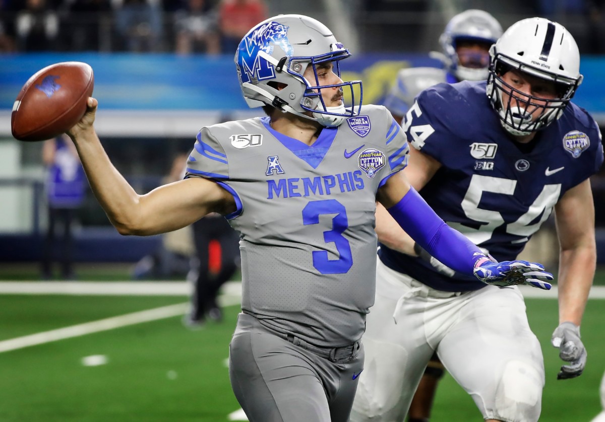 <strong>University of Memphis quarterback Brady White (left) looks to make a throw against Penn State defender Robert Windsor (right) during action at the Cotton Bowl on Dec. 28, 2019, at AT&amp;T Stadium in Arlington, Texas.</strong> (Mark Weber/Daily Memphian)