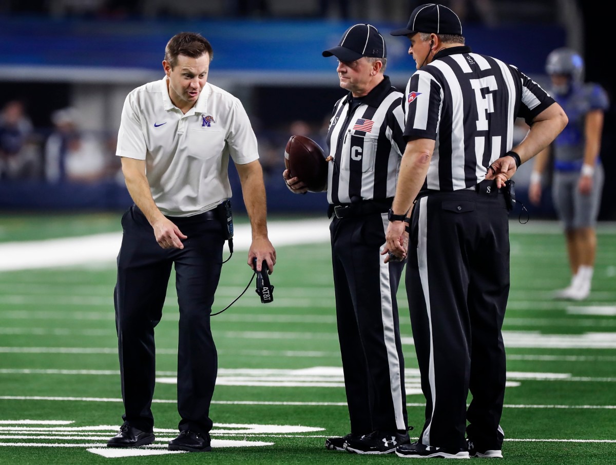 <strong>University of Memphis head coach Ryan Silverfield (left) makes his case to the officials during a break in action against Penn State at the Cotton Bowl on Dec. 28, 2019, at AT&amp;T Stadium in Arlington, Texas.</strong> (Mark Weber/Daily Memphian)