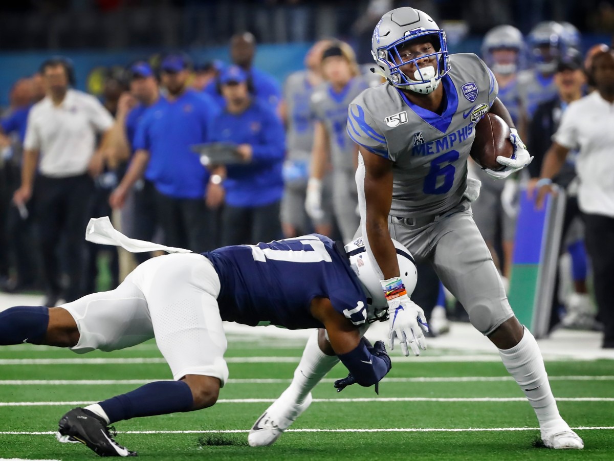 <strong>University of Memphis running back Patrick Taylor Jr. (right) fights for a first down against Penn State defender Garrett Taylor (left) during action at the Cotton Bowl on Dec. 28, 2019, at AT&amp;T Stadium in Arlington, Texas.</strong> (Mark Weber/Daily Memphian)