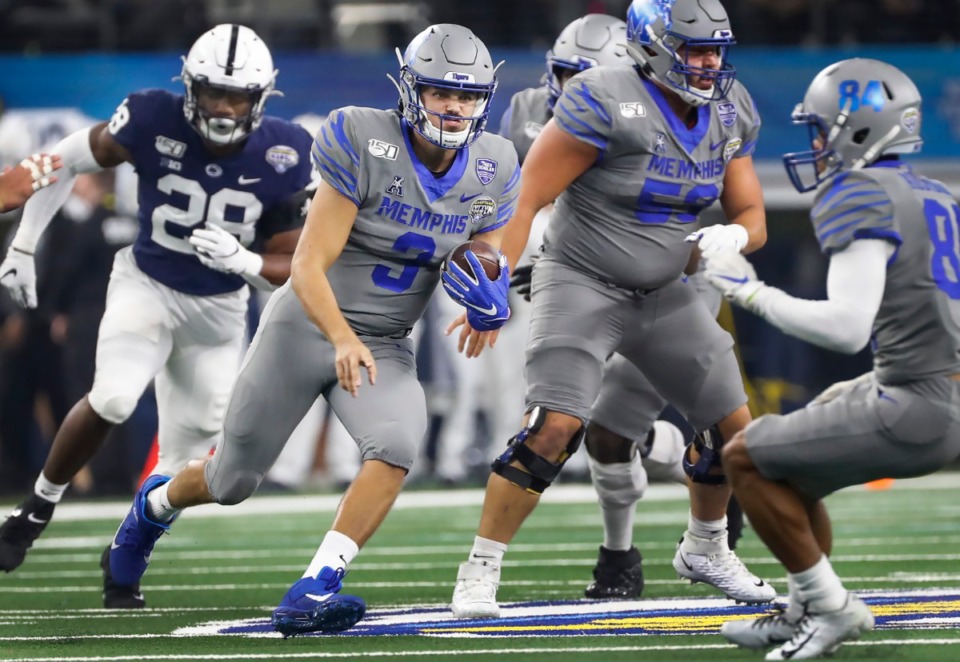 <strong>University of Memphis quarterback Brady White (middle) looks for a lane against the Penn State defense during action at the Cotton Bowl on Dec. 28, 2019, at AT&amp;T Stadium in Arlington, Texas.</strong> (Mark Weber/Daily Memphian)