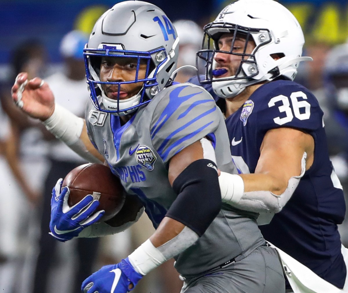 <strong>University of Memphis receiver Antonio Gibson (left) makes a first down catch against Penn State defender Jan Johnson (right) during action at the Cotton Bowl on Dec. 28, 2019, at AT&amp;T Stadium in Arlington, Texas.</strong> (Mark Weber/Daily Memphian)