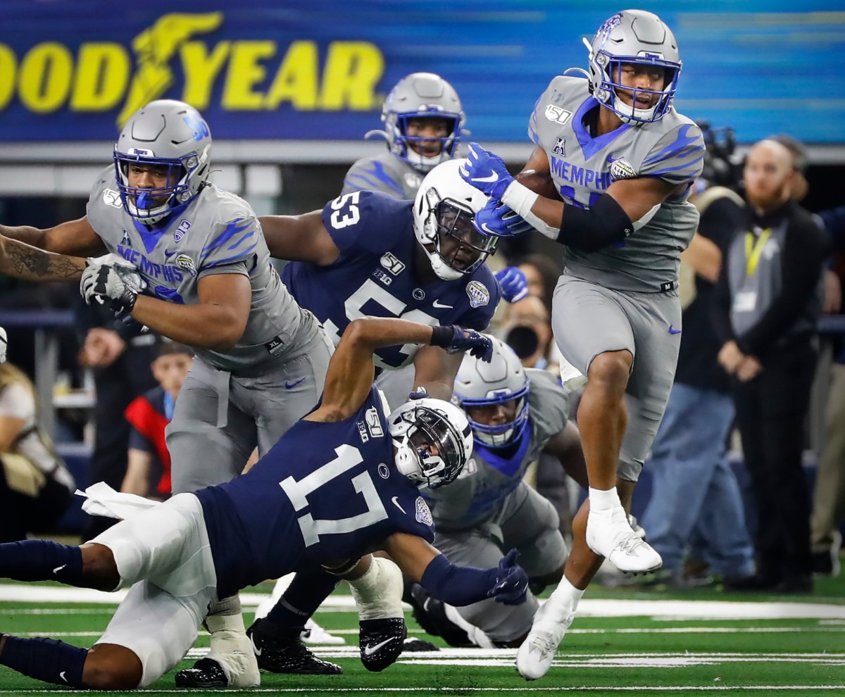 <strong>University of Memphis receiver Antonio Gibson (right) looks for positive yards against the Penn State defense during action at the Cotton Bowl on Dec. 28, 2019, at AT&amp;T Stadium in Arlington, Texas.</strong> (Mark Weber/Daily Memphian)