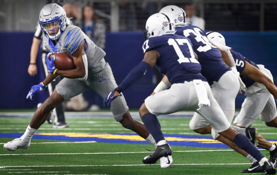 <strong>University of Memphis receiver Damonte Coxie (left) looks for positive yards agains the Penn State defense during action at the Cotton Bowl on Dec. 28, 2019, at AT&amp;T Stadium in Arlington, Texas.</strong> (Mark Weber/Daily Memphian)