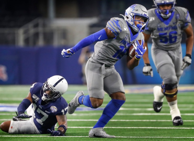 <strong>University of Memphis running back Kenneth Gainwell (right) run for a first down past Penn State defender Garrett Taylor (left) during action at the Cotton Bowl Saturday, Dec. 28, 2019 at AT&amp;T Stadium in Arlington, Texas.</strong> (Mark Weber/Daily Memphian)