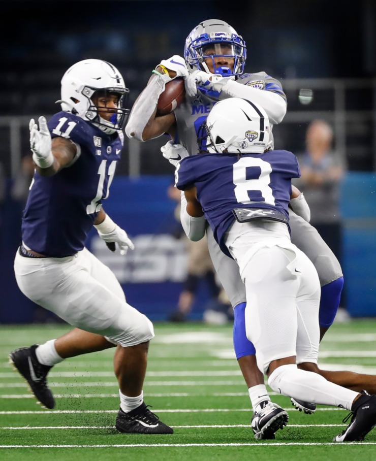 <strong>University of Memphis tight end Tyce Daniel (middle) makes a catch against Penn State defender Micah Parsons (left) and Marquis Wilson (right) during action at the Cotton Bowl Saturday, Dec. 28, 2019 at AT&amp;T Stadium in Arlington, Texas.</strong> (Mark Weber/Daily Memphian)