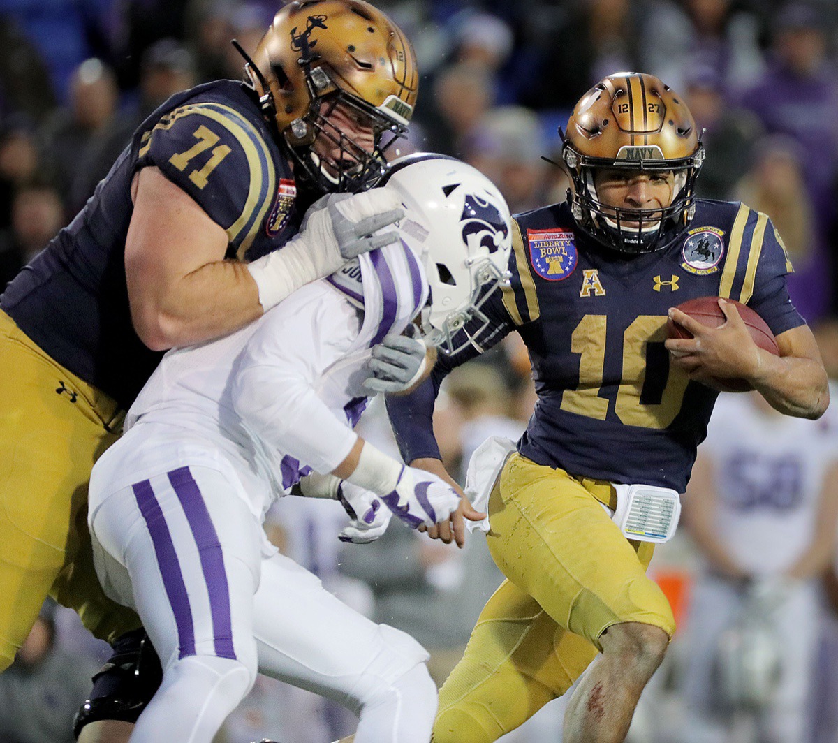 <strong>Navy quarterback Malcom Perry (10) rushes the ball during the AutoZone Liberty Bowl Dec. 31, 2019.</strong> (Patrick Lantrip/Daily Memphian)