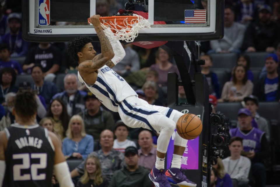<strong>Grizzlies guard Ja Morant (12) dunks against the Sacramento Kings in Sacramento, Calif., Thursday, Jan. 2, 2020.</strong> (Randall Benton/AP)